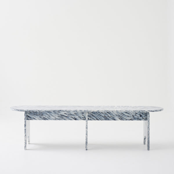 Marble bench against a white background, showing smooth texture and elegant design