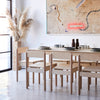 Dining Room with Minimalist Natural Coloured Wooden Dining Table and Chairs with Tablewares on Top