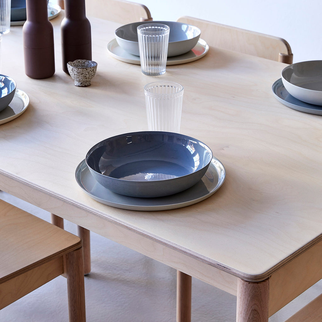 Minimalist Natural Coloured Wooden Dining Table with Tableware on Top