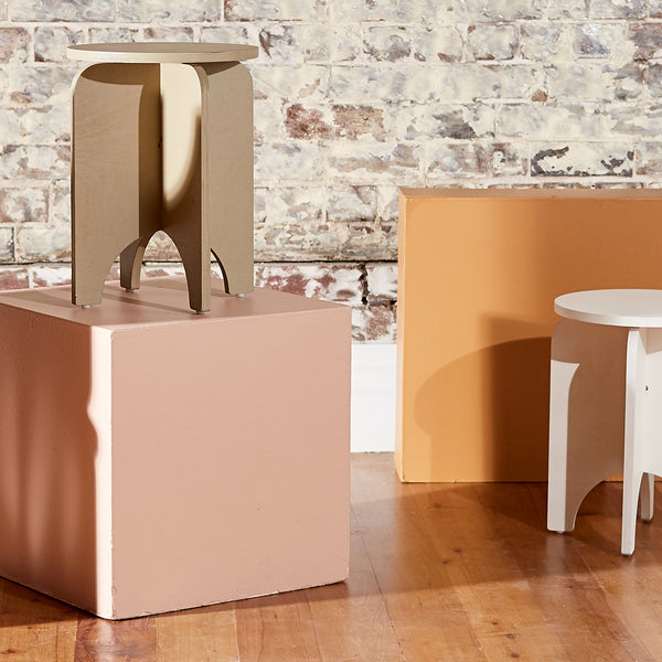 modern plywood stools in a styled interior setting