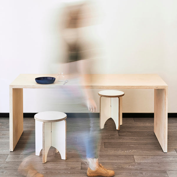 Wooden Rectangular TableBlurred Person Walking Past a Plywood Dining Table Desk in Natural