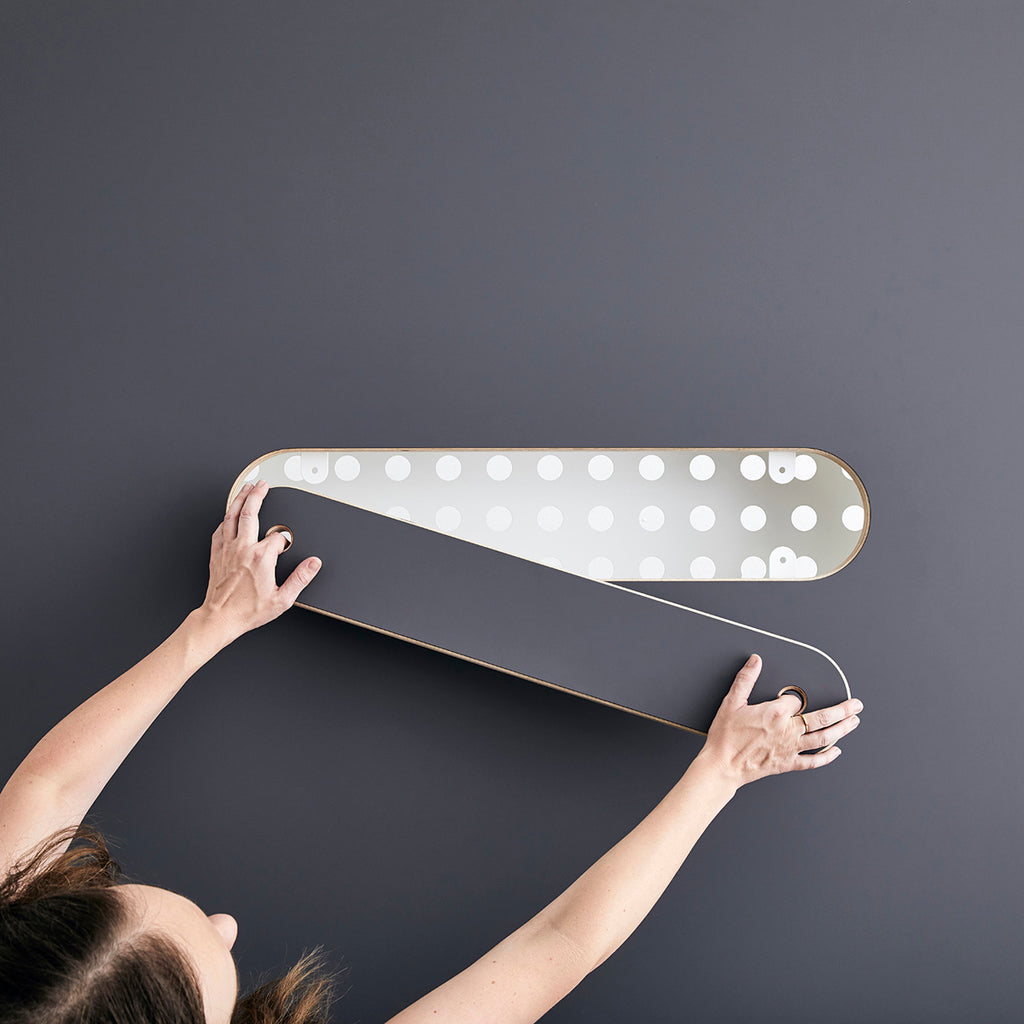 Woman Pulling the Cover of the Team Table Cable Management Cut-out