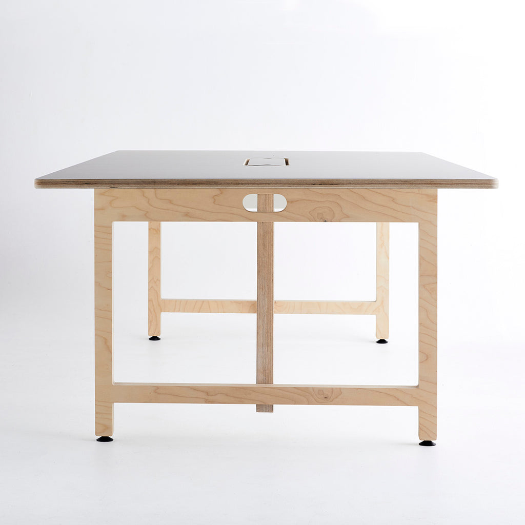 Side View of a Team Table with Ultra Matt Finish Surface and Plywood Base in a Plain White Background