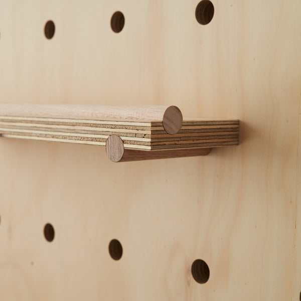 Pegboard cutaways for furniture, shown in a clean, professional style.