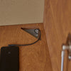 Detailed View of Plywood Fold Out Desk with Hole for Wire and Charging Accessories