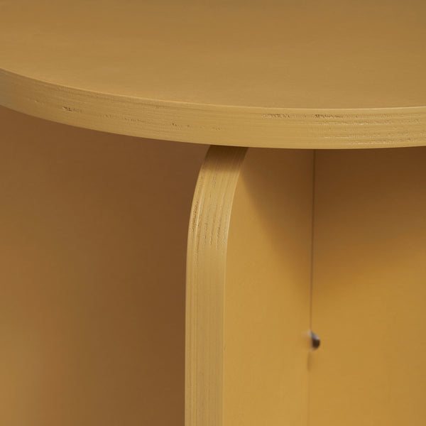 A close-up view of a corner yellow plywood stool