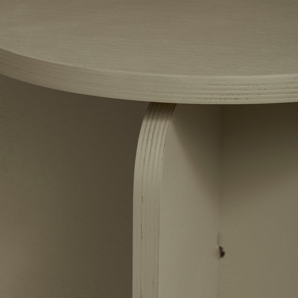 Close-up view of the olive green plywood stool