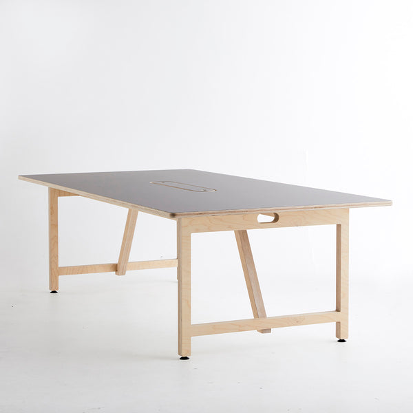 Side View of a Team Table with Ultra Matt Finish Surface and Plywood Base